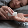 Melatonin tablets with a sleep and wellness theme representing prescription sleep support in the UK